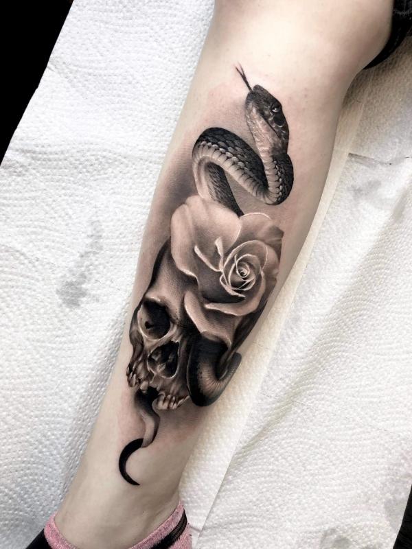 Black and white rose and snake with skull tattoo