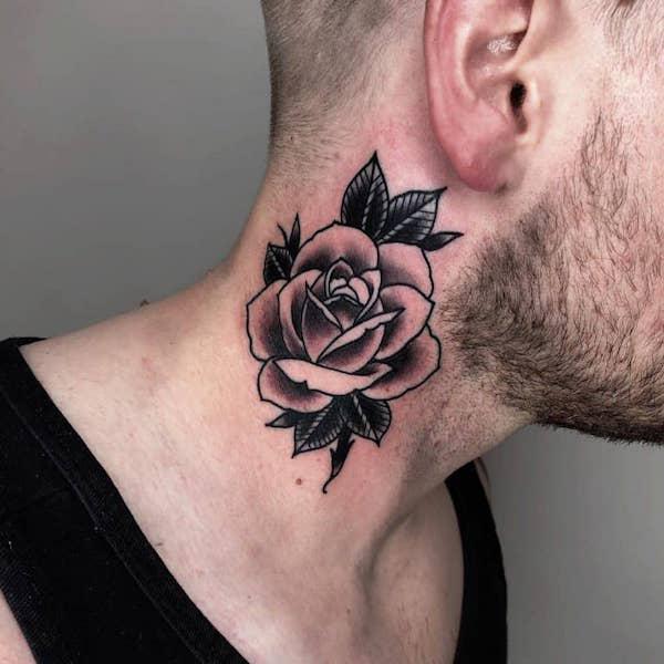 Black and white rose neck tattoo
