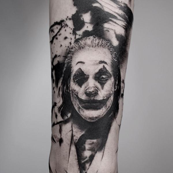 Black ink Joaquin Phoenix joker tattoo