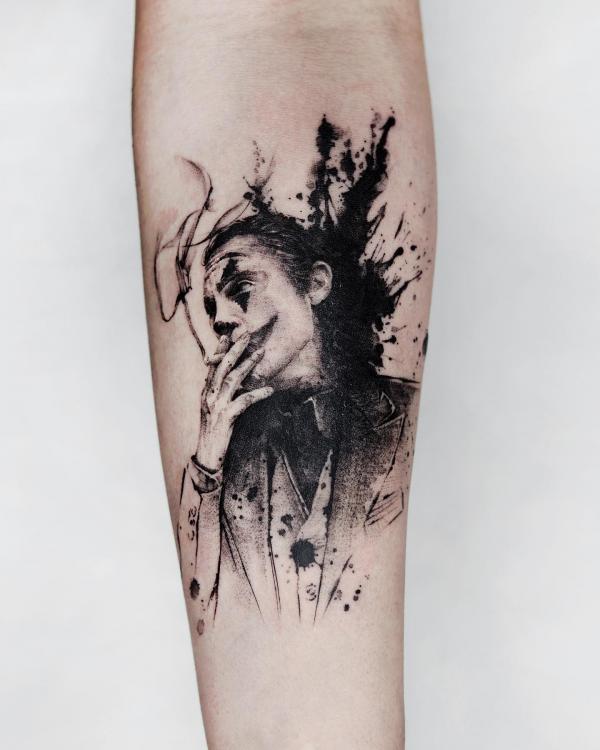 Black ink joker tattoo