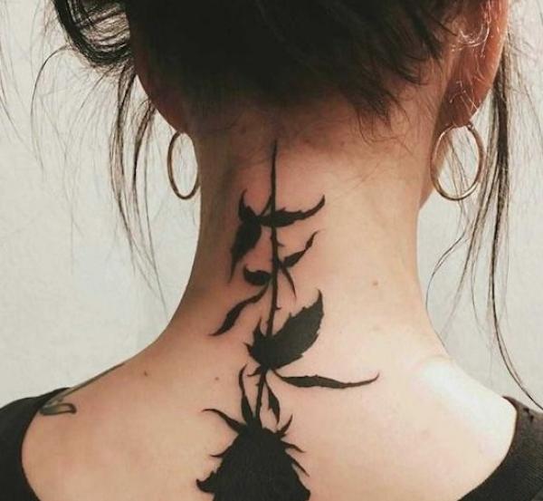 Black inke rose nape tattoo