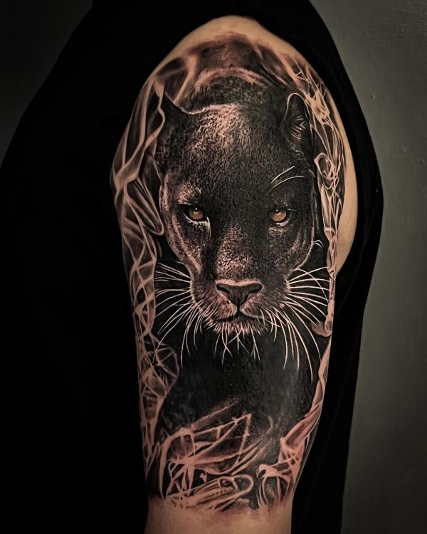 Black panther half sleeve tattoo