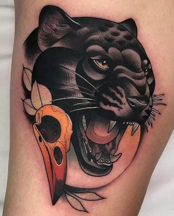 Black panther head and bird skull tattoo