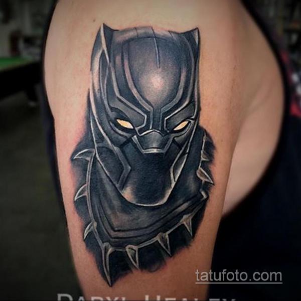 Black panther tattoo marvel on upper arm