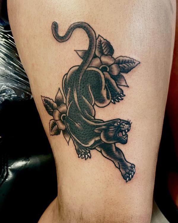 Black panther with flower tattoo