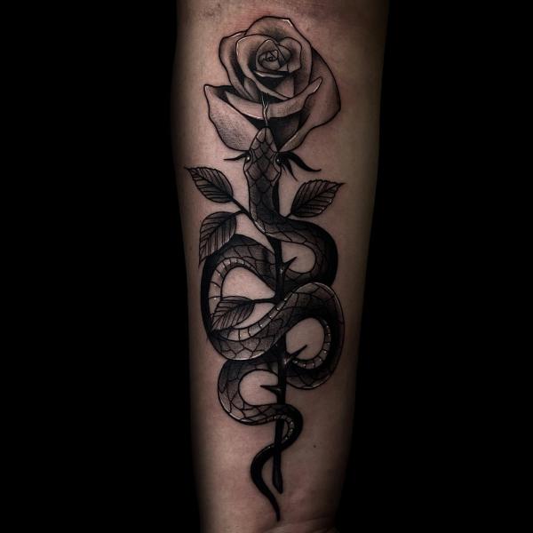 Blackword snake and rose tattoo forearm