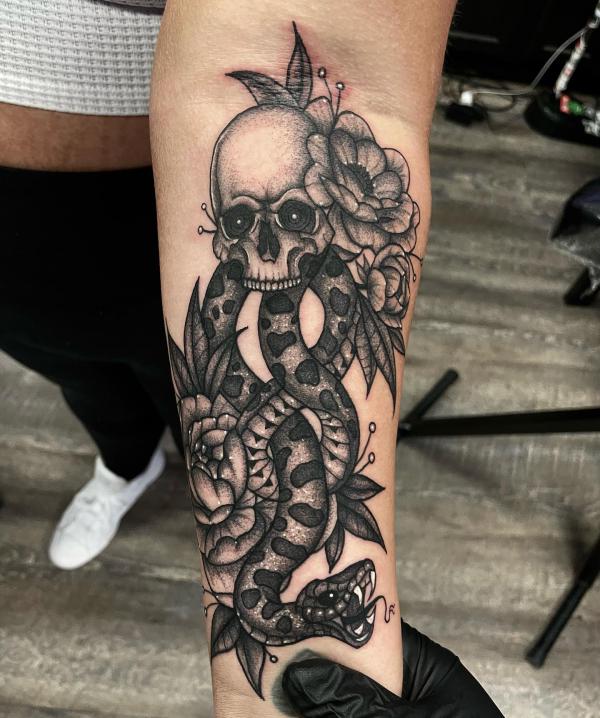 Blackwork death eater with flowers forearm tattoo