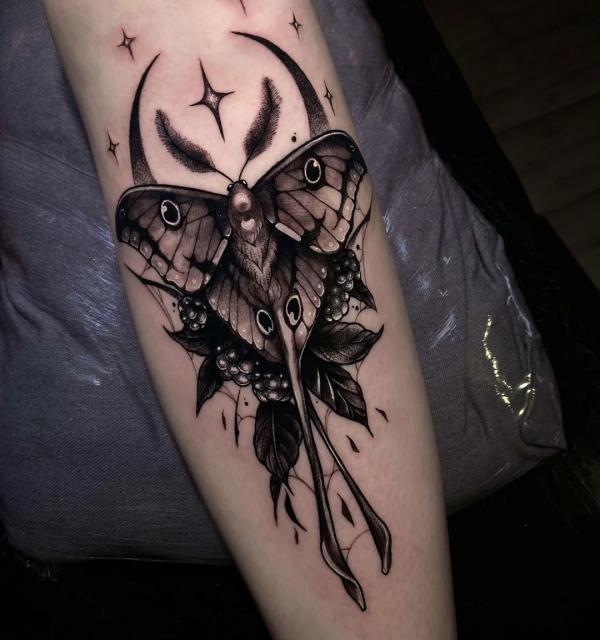 Blackwork luna moth and berry with moon and stars tattoo