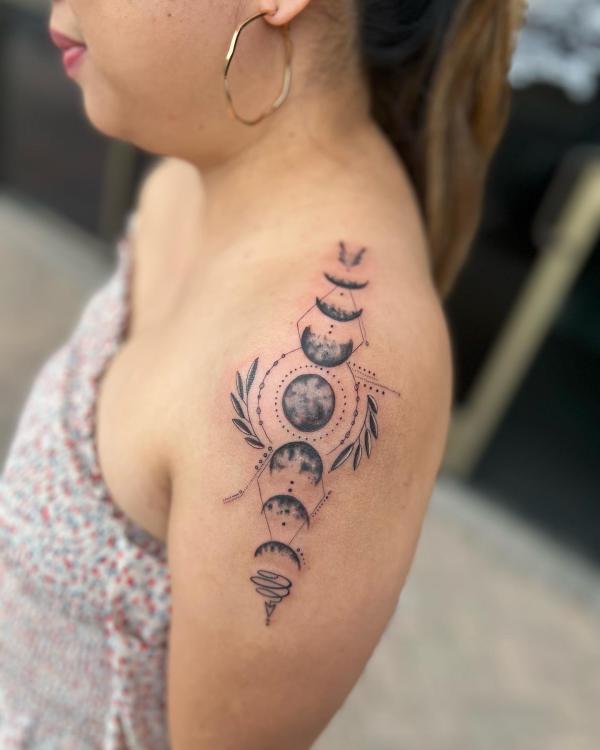 Botanical Moon phases shoulder tattoo