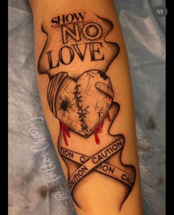Broken heart with words Show No Love Caution