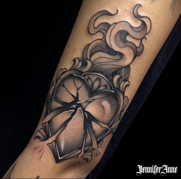Broken sacred heart forearm tattoo