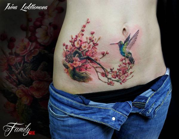 Cherry blossom and hummingbird belly tattoo
