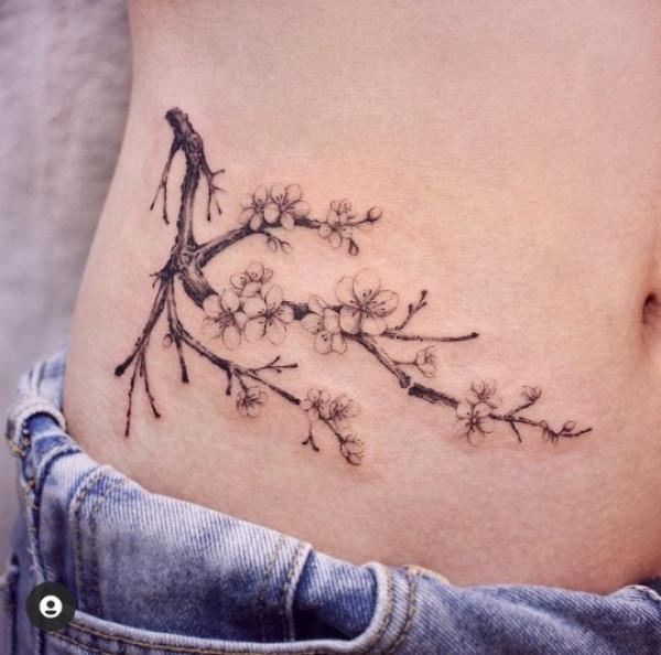 Cherry blossom side abdomen tattoo