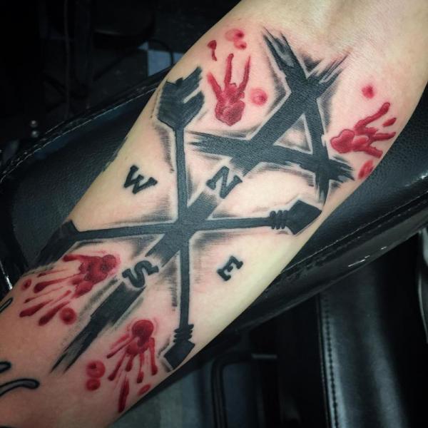 Chi Rho brush with bloody handprint tattoo