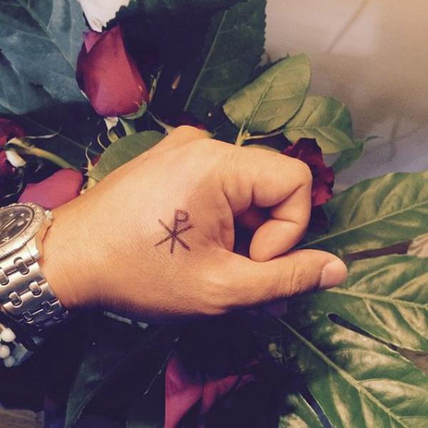 Chi Rho finger tattoo