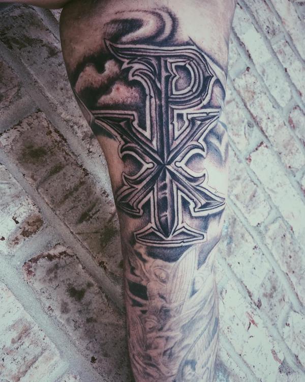 Chi Rho lower leg tattoo