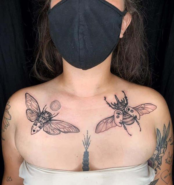 Cicada and beetle chest tattoo
