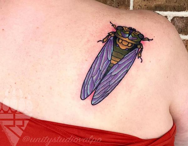 Cicada shoulder blade tattoo