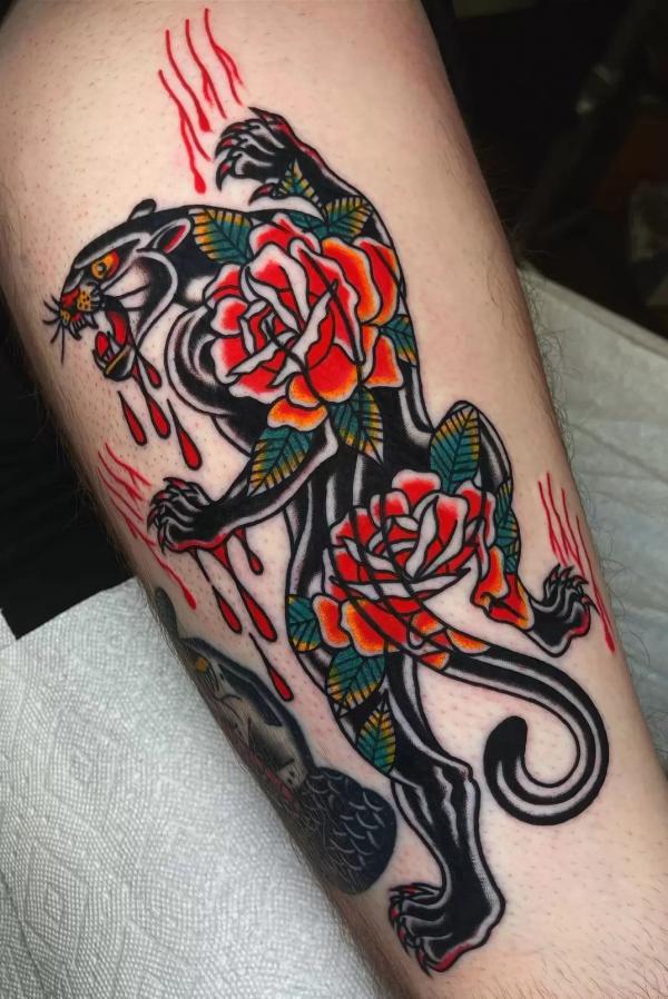 Climbing bloody panther with roses tattoo
