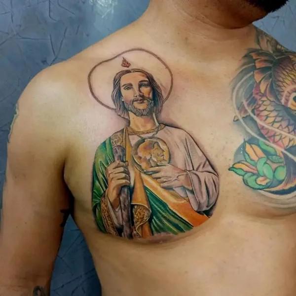 Colored San Judas tattoo on one side of chest