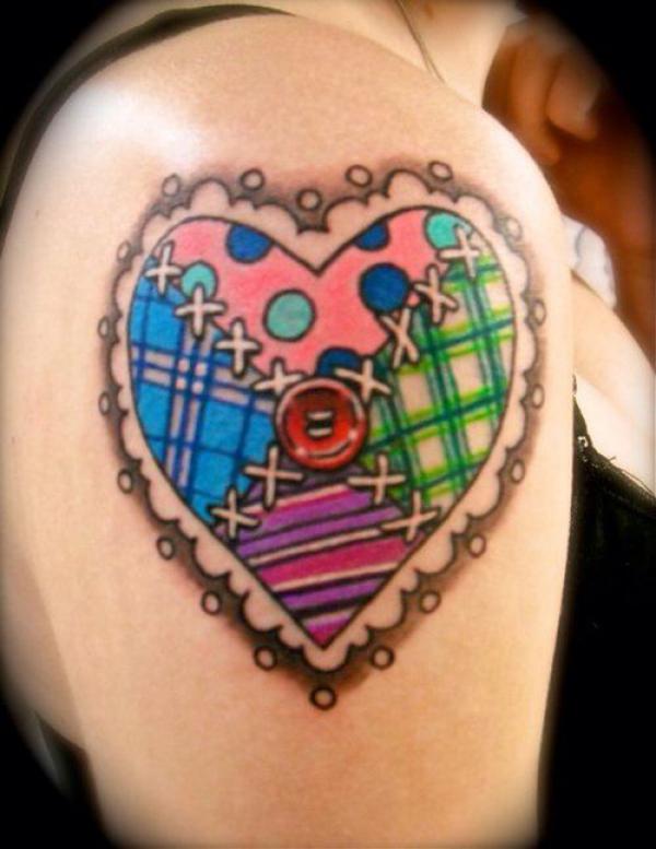 Colorful broken heart with stitches tattoo