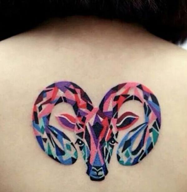 Colorful geometric Aries back tattoo