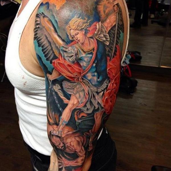 Colorful st michael slaying the devil tattoo