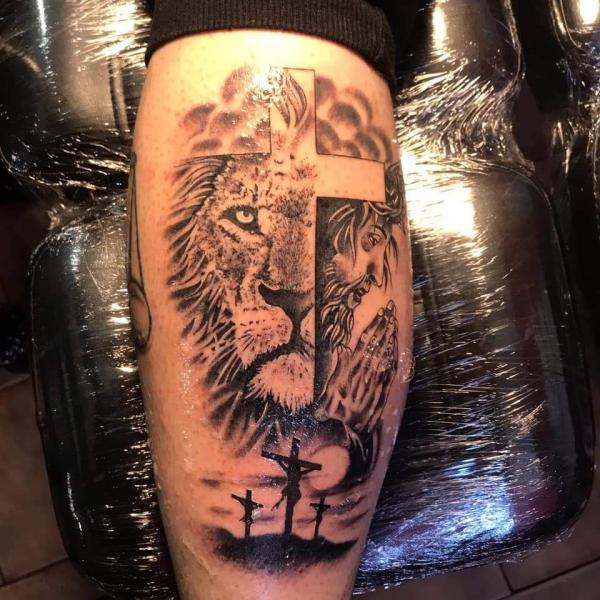 Cross lion and Jesus calf tattoo