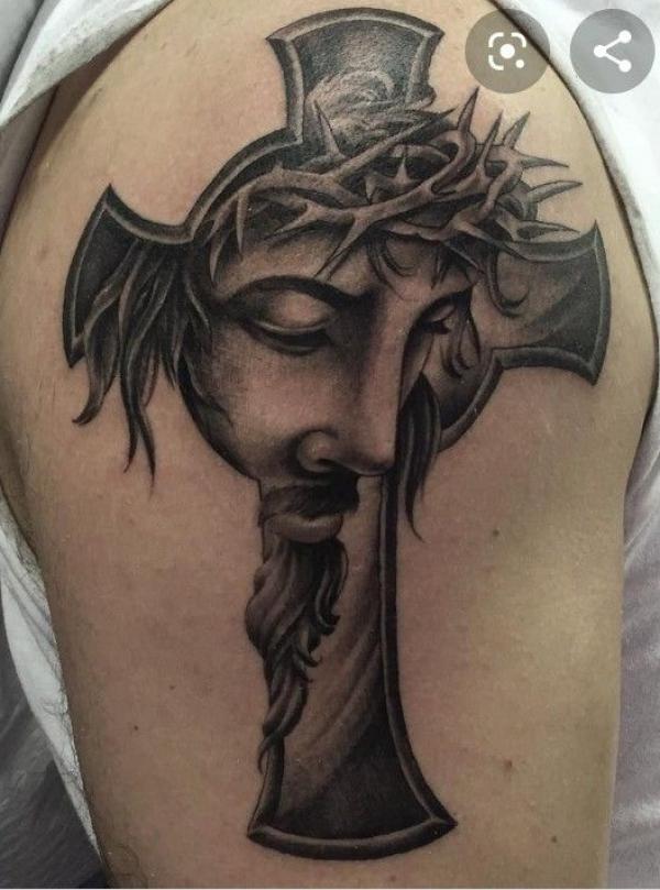 Cross with Jesus face shoulder tattoo
