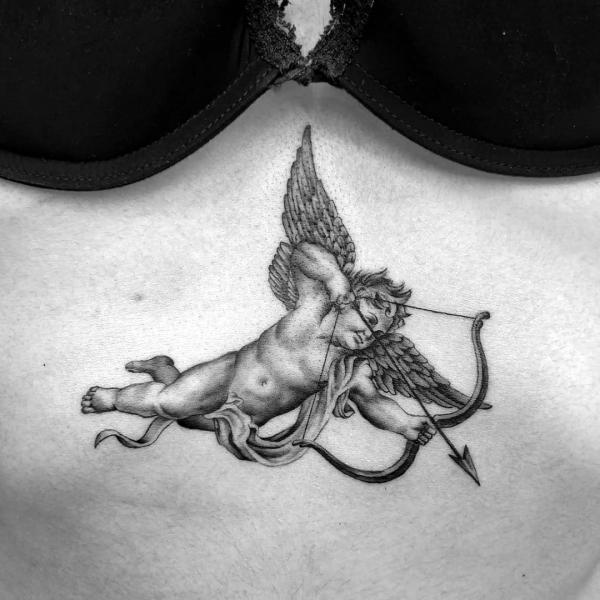 Cupid stomach tattoo black and grey