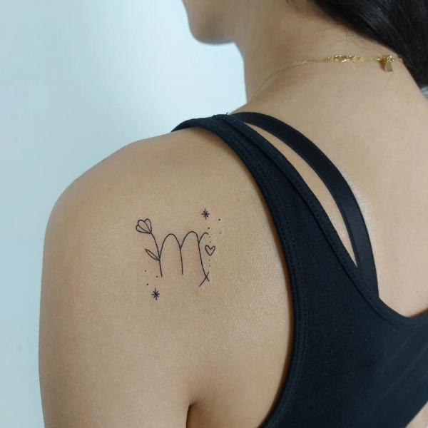 Cute Virgo glyph shoulder blade tattoo