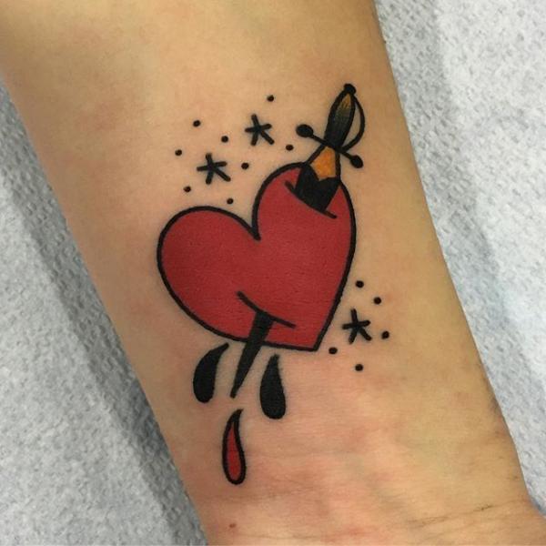 Dagger through dripping heart tattoo
