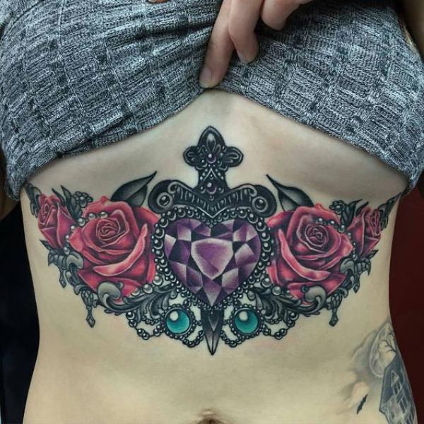 Dagger with diamond and roses abdomen tattoo