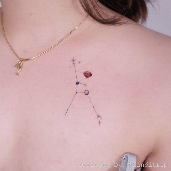 Dainty Zodiac cancer constellation chest tattoo