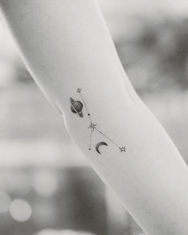 Dainty Zodiac cancer constellation with planet and moon tattoo
