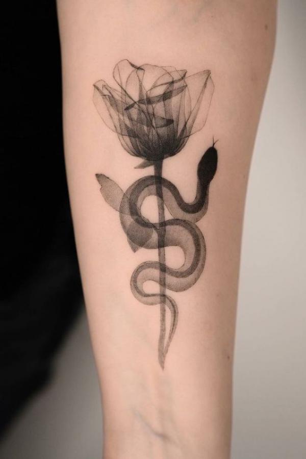 Dainty black ink rose and snake tattoo