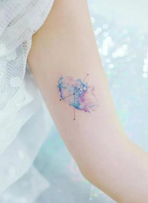 Dainty watercolor Zodiac cancer constellation upper arm tattoo for female