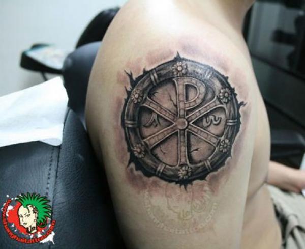 Dark Chi Rho shoulder tattoo