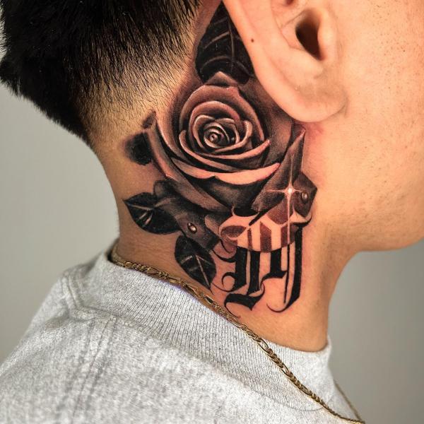 Dark rose with custom lettering tattoo on the side of neck