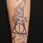 Dotwork deathly hallows with Sorting Hat forearm tattoo