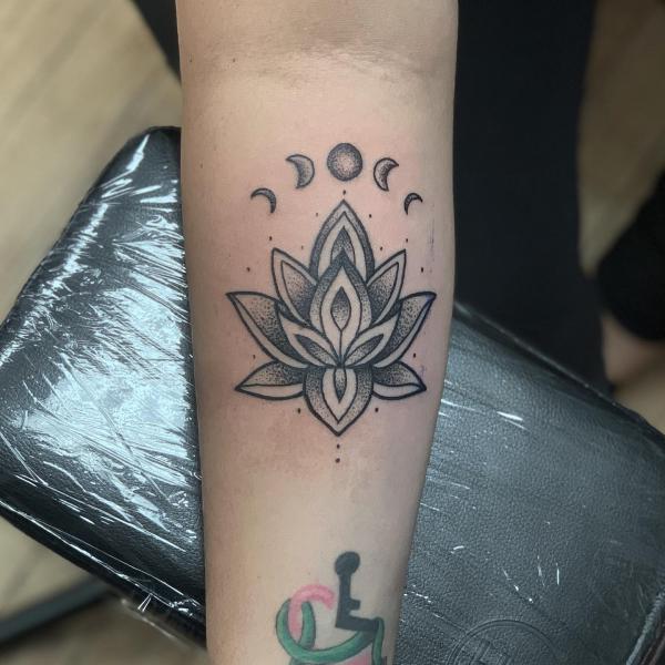 Dotwork moon phases and lotus tattoo