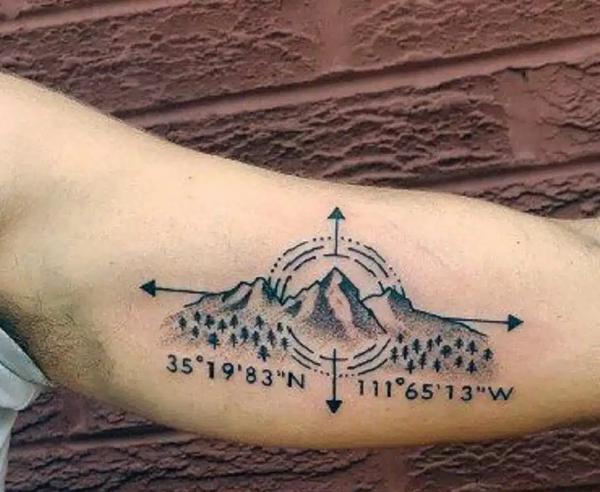 Dotwork mountain with coordinates tattoo