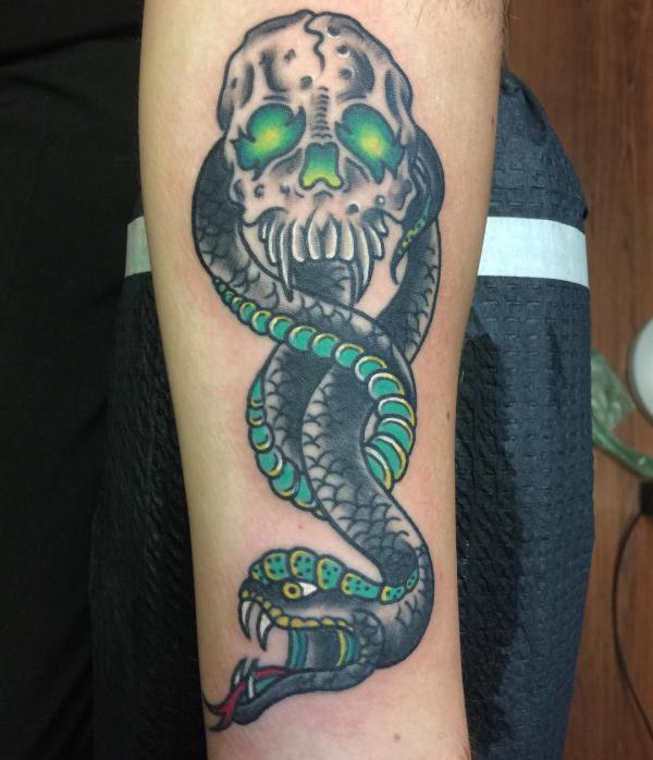 Eerie green filled death eater sleeve tattoo