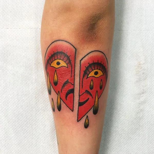 Face broken heart tattoo