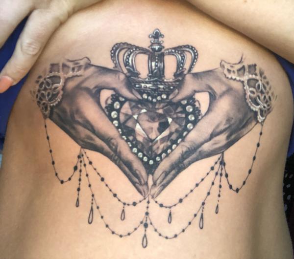Feminine Claddagh stomach tattoo black and grey