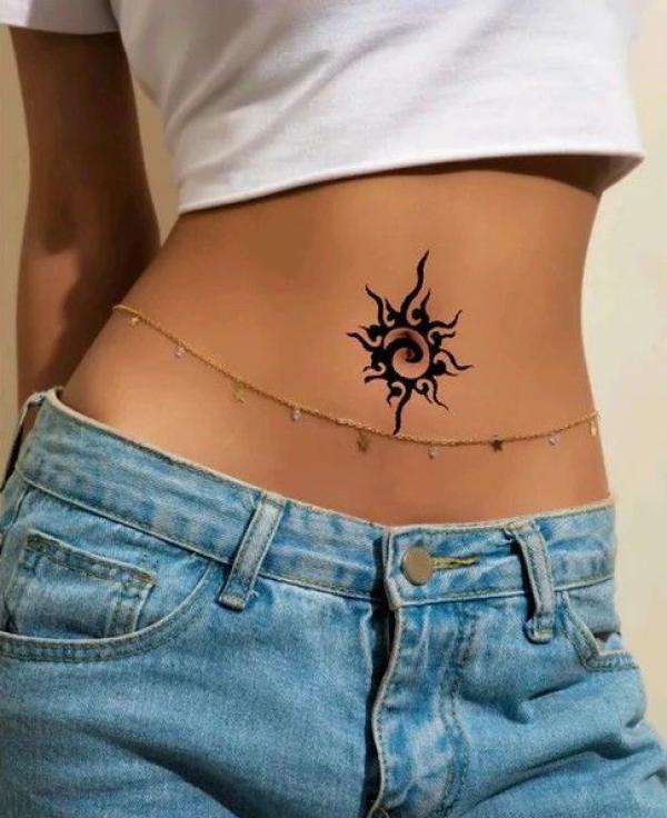 Firing sun belly button tattoo