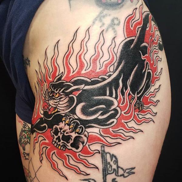 Flaming panther side hip tattoo