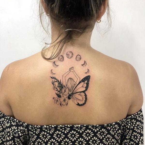 Floral butterfly and moon phases back tattoo