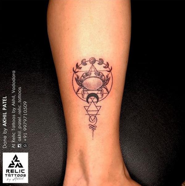 Geometric Zodiac cancer with moon phases tattoo