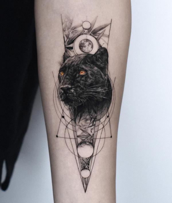 Geometric black realistic panther tattoo on forearm